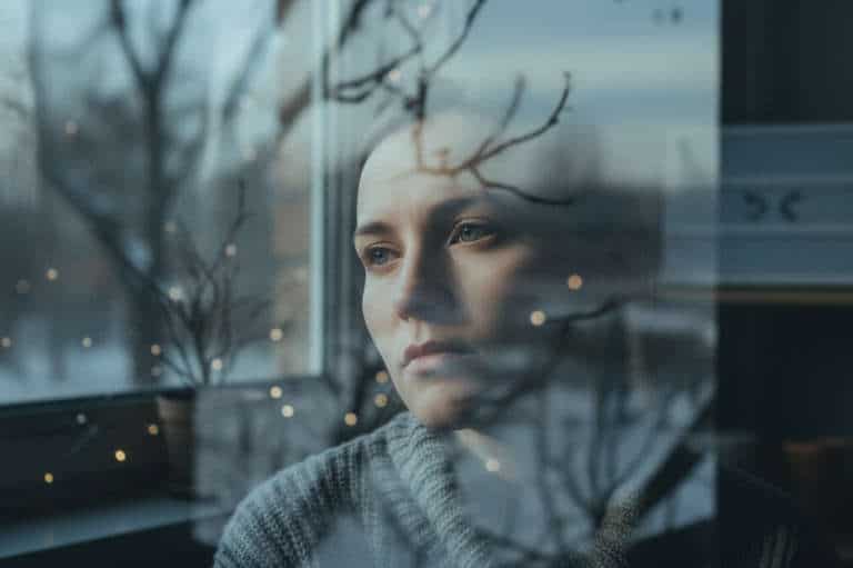 sad woman at window How to recover from SAD